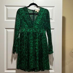 Like New Michael Kors size 4 emerald green leopard dress. Sheer long sleeve.